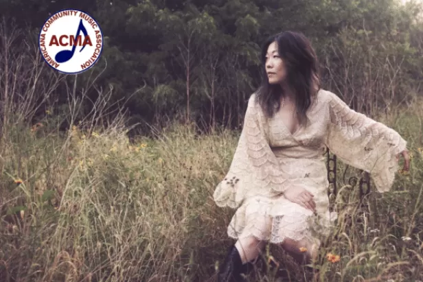 Betty Soo in a field; ACMA logo in corner

